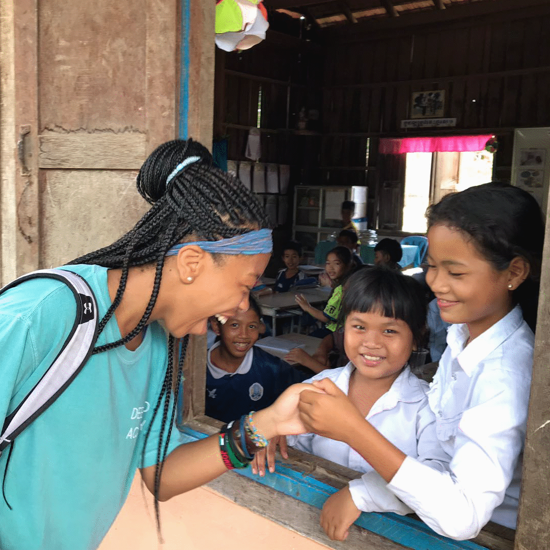 community service programs include work with children thumb war between girls in Cambodia VISIONS Service Adventures