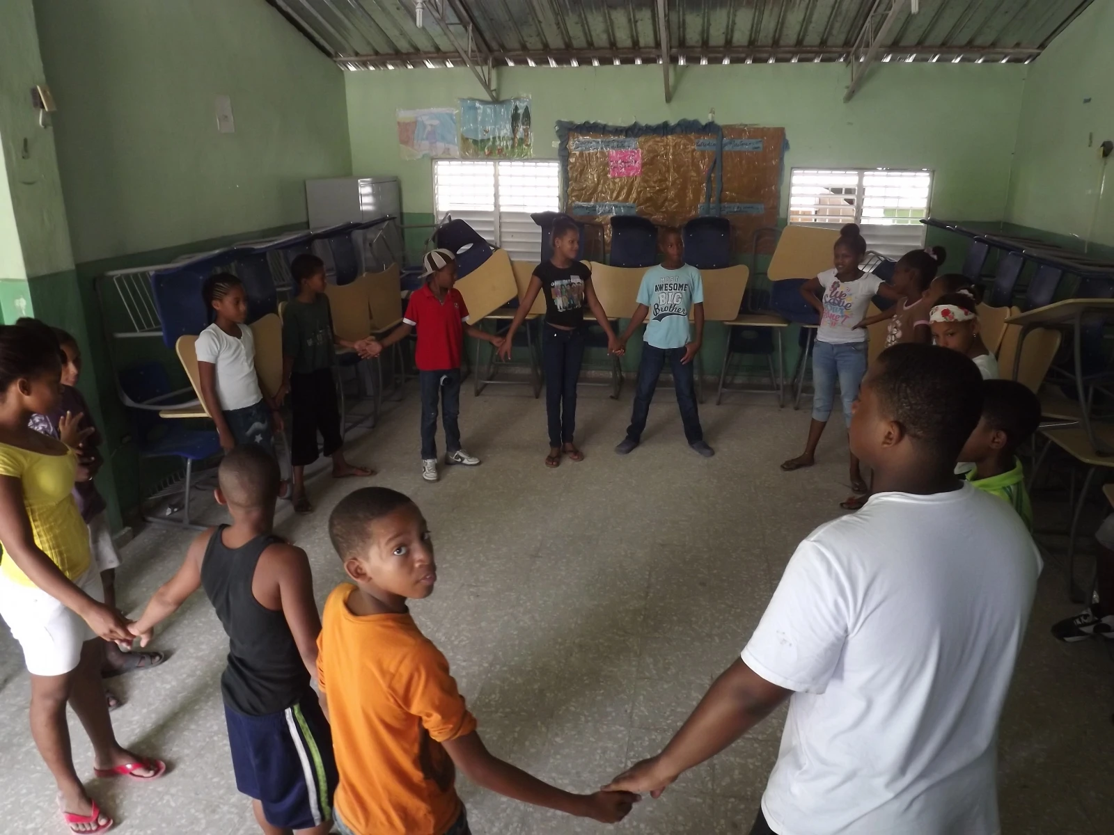 Local kids standing in a circle in the vision summer program