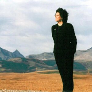 Montana woman standing in front of the mountains