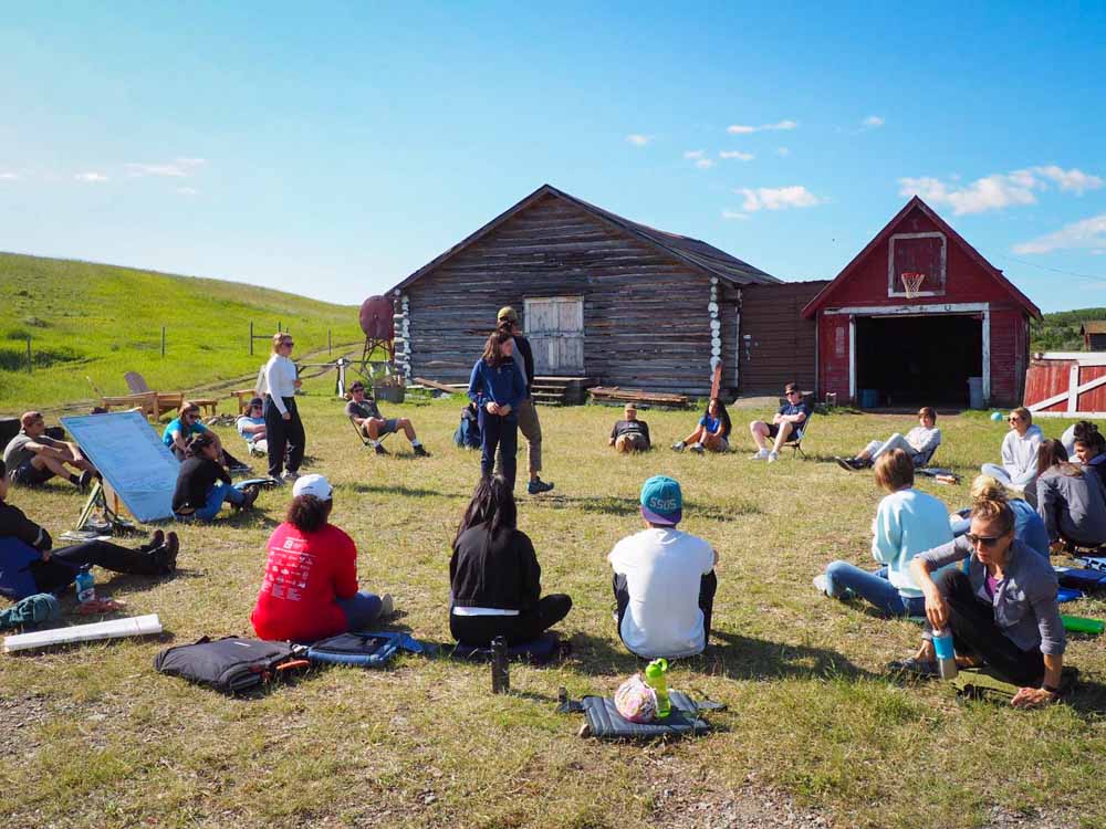 Student volunteers play an icebreaker game on a ranch in Montana.