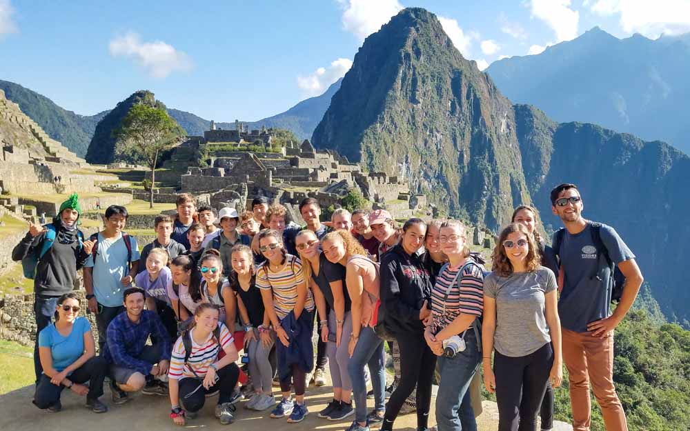 Group of volunteers at Machu Picchu on Peru summer service trip.