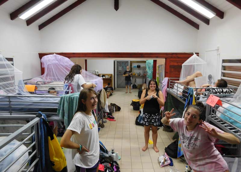 teen volunteers hang out in bunk room of home away from home