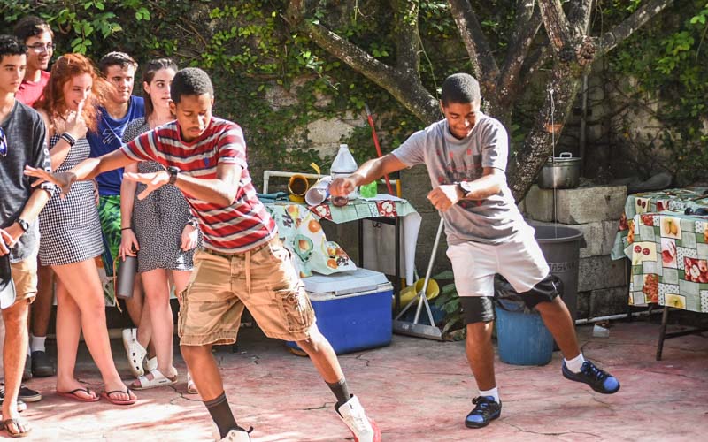Dominican teens dance to Thriller by Michael Jackson for a teen summer service program