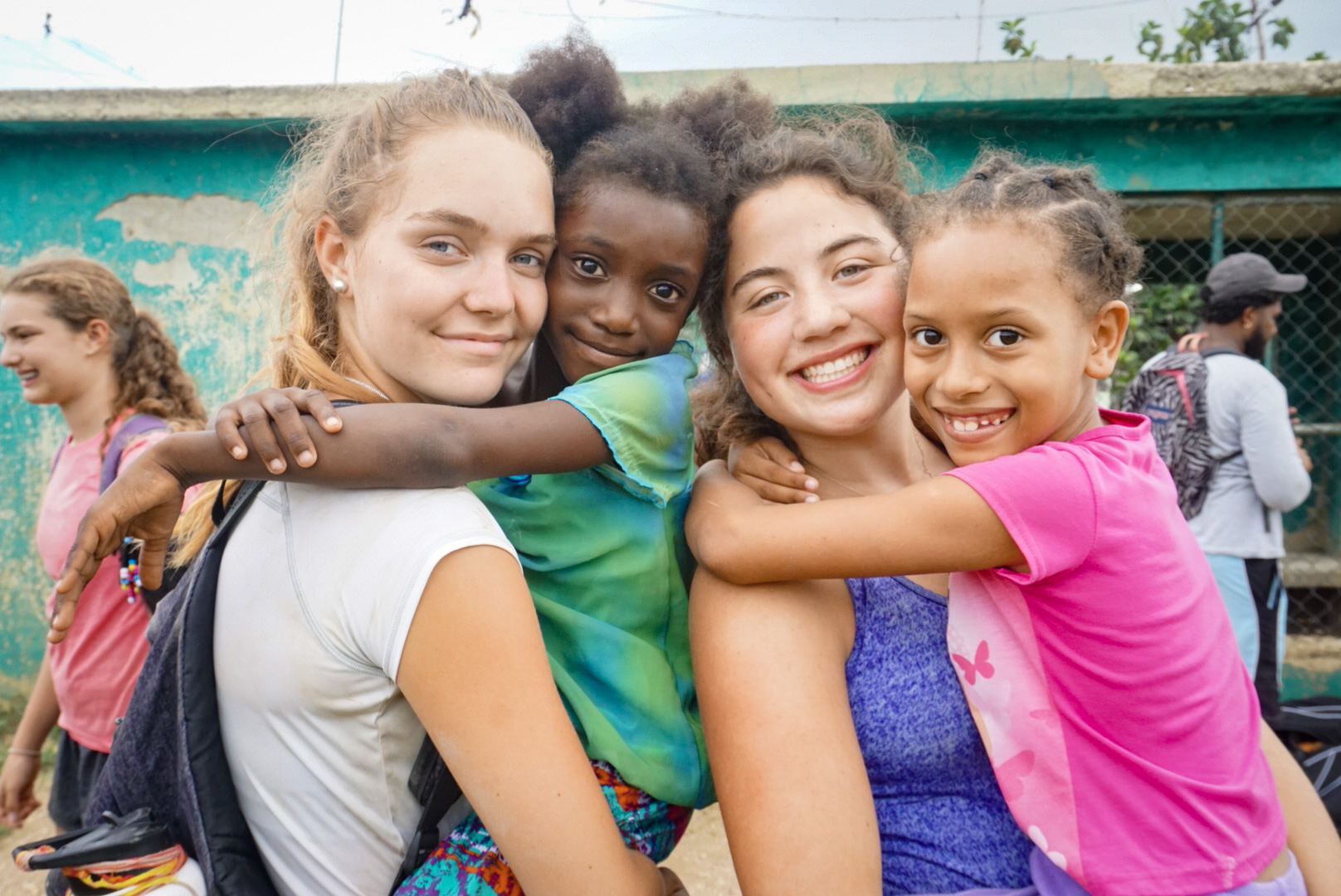 Teen volunteers with school children at camp in the Dominican Republic