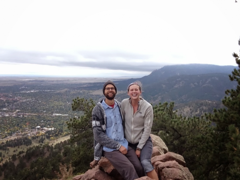 Barry & Nolan sit at a summit along the Canadian Rockies