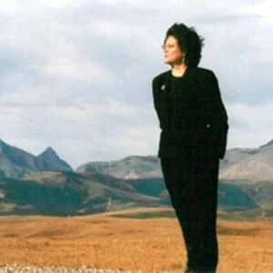 Montana woman standing in front of the mountains