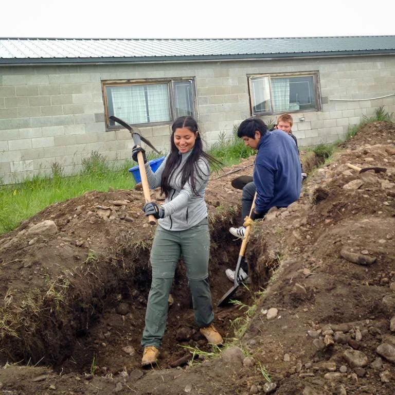 teens trying digging the ground