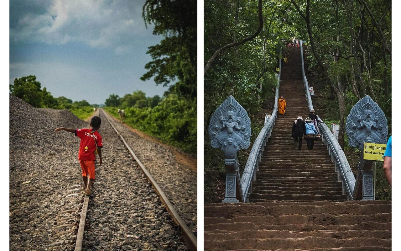 a boy balancing on a railroad track in cambodia