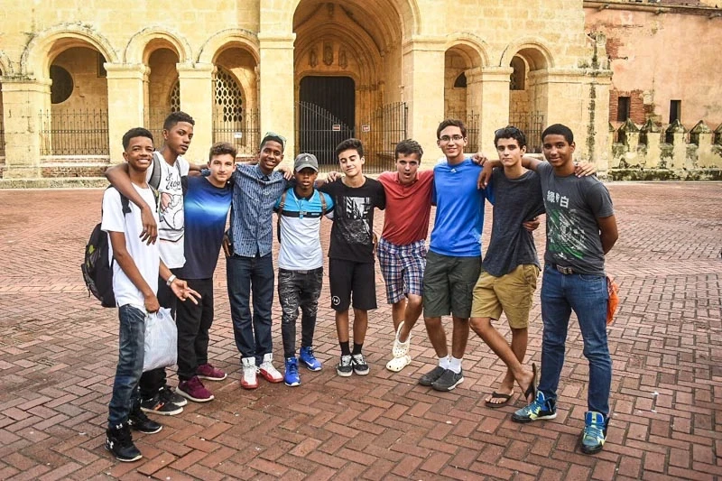 high school students of mixed ethnicities posing in plaza