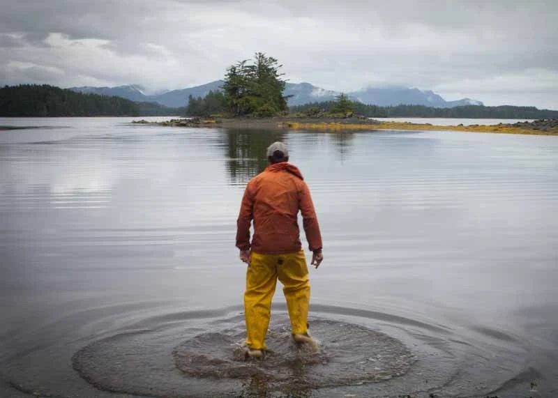 a man standing on river