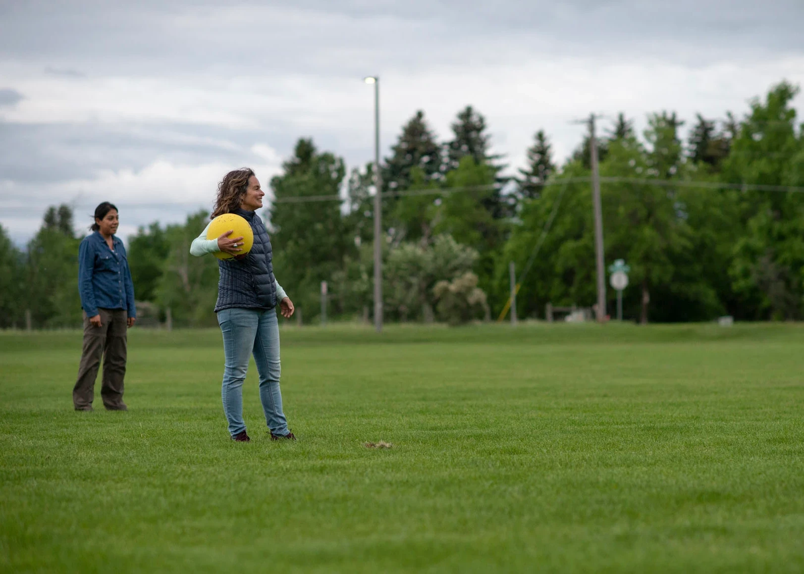 Visions leader holds kickball waiting to pitch