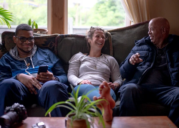VISIONS leaders from around the world sit on a couch and laugh together