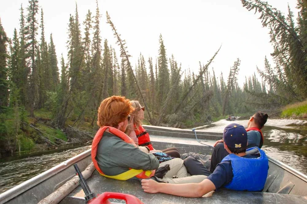 Teens boating on river