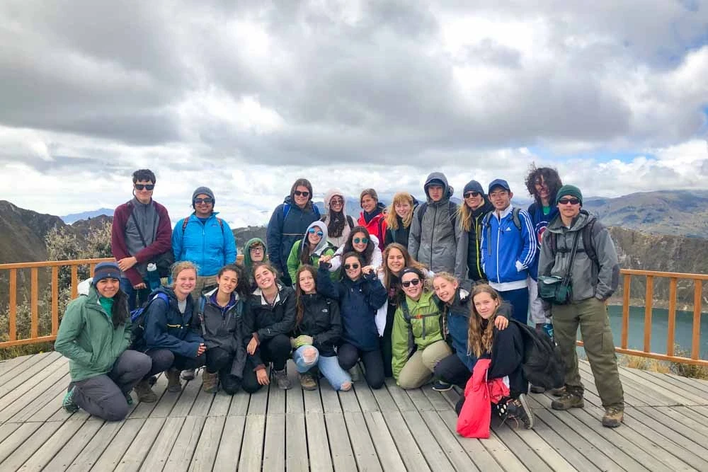 A group of teen VISIONS volunteers poses for a group photo in Ecuador.