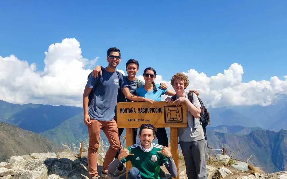 Group of hikers at the top of Montaña Machu Picchu on Peru summer service trip.