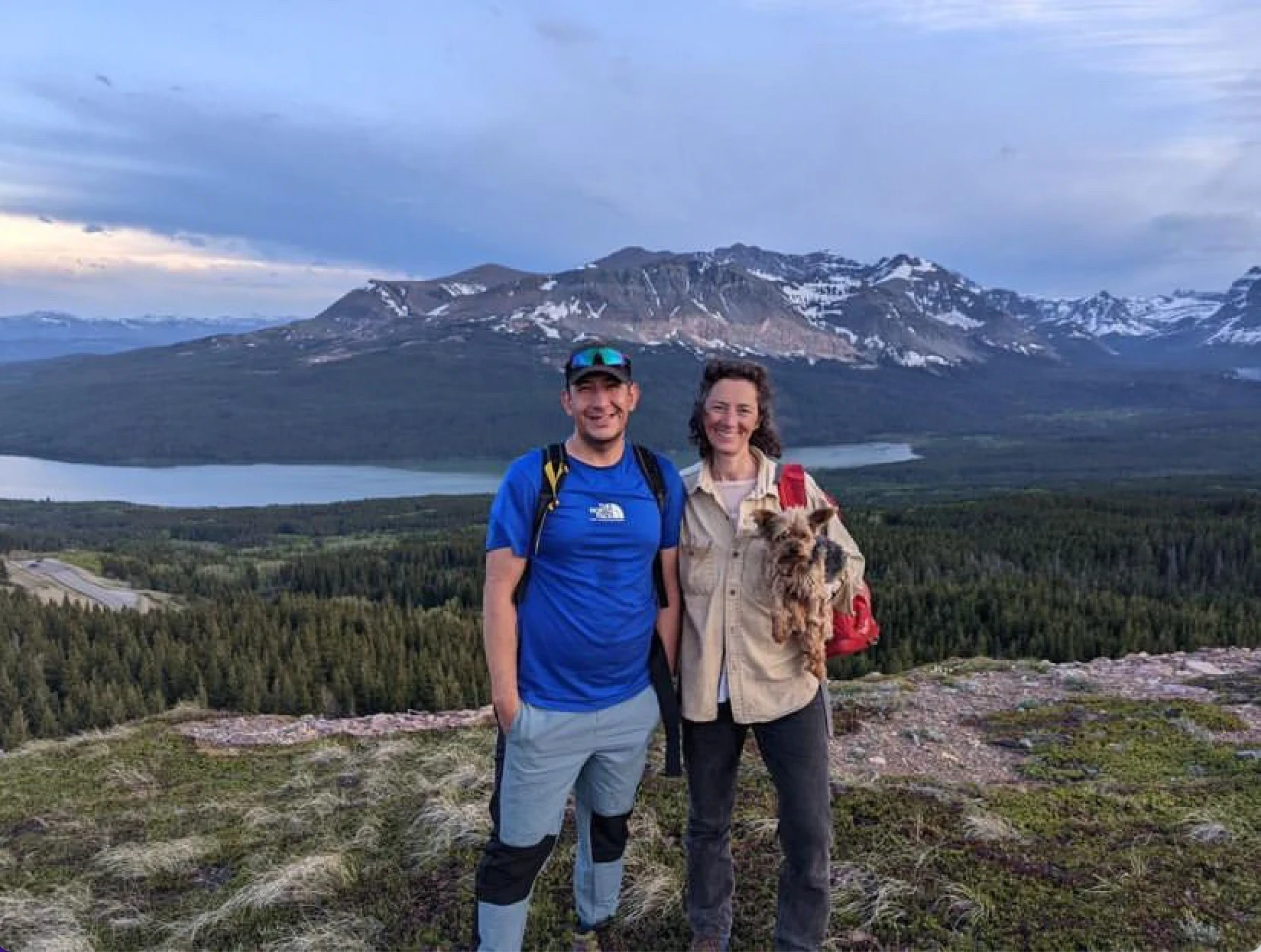 Barry & Nolan sit at a summit along the Canadian Rockies