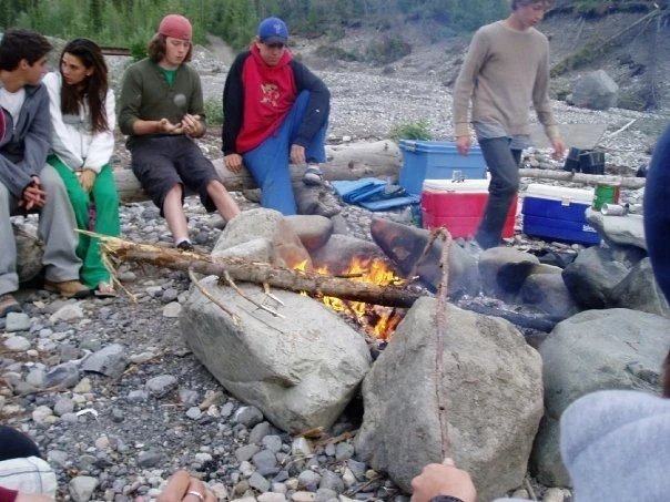 PATRICK FLEMING , VISIONS ALUM AK 2008 campfire Barry & Nolan sit at a summit along the Canadian Rockies