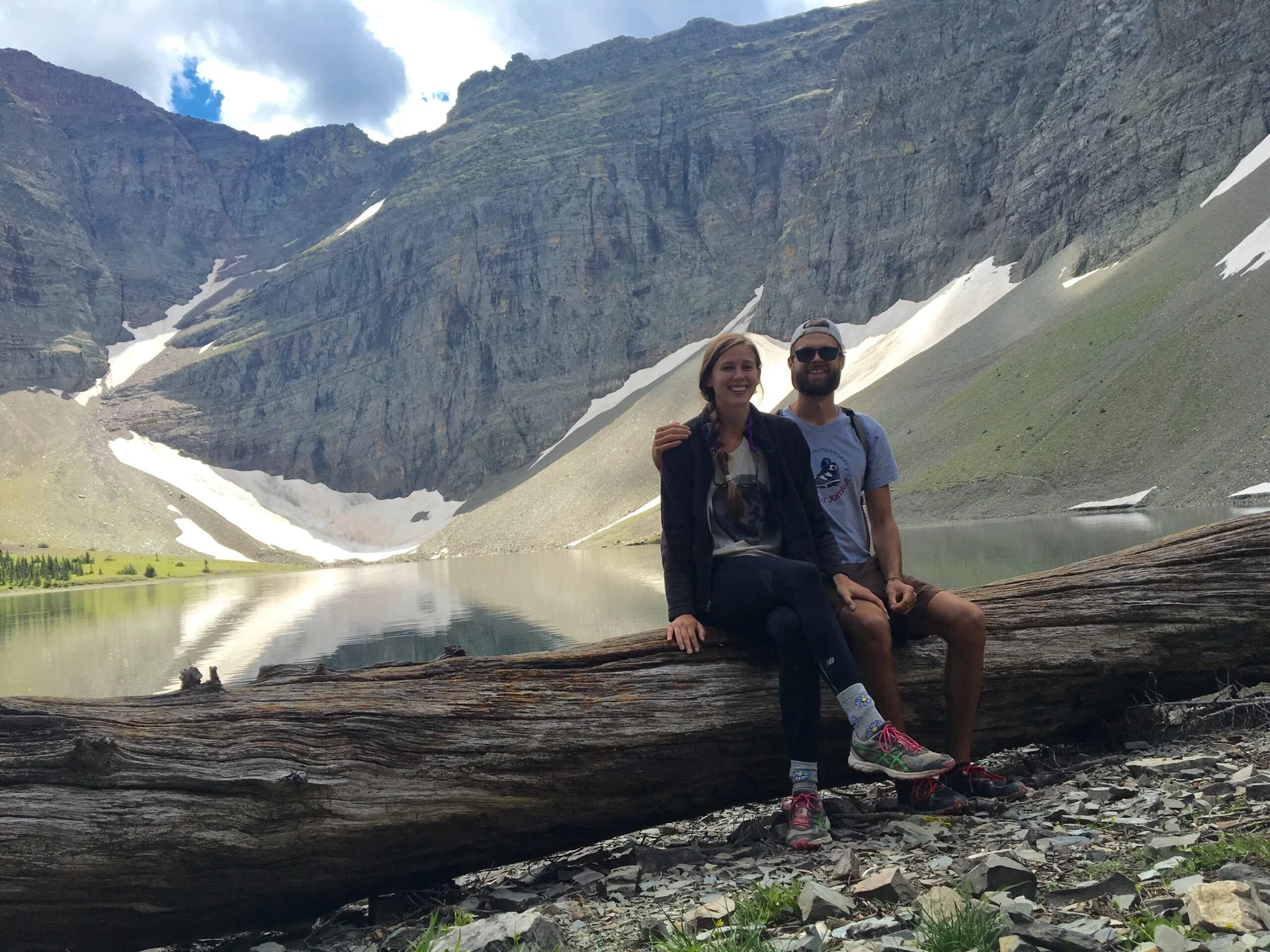 Barry and Nolan sit on a log in the Canadian Rockies