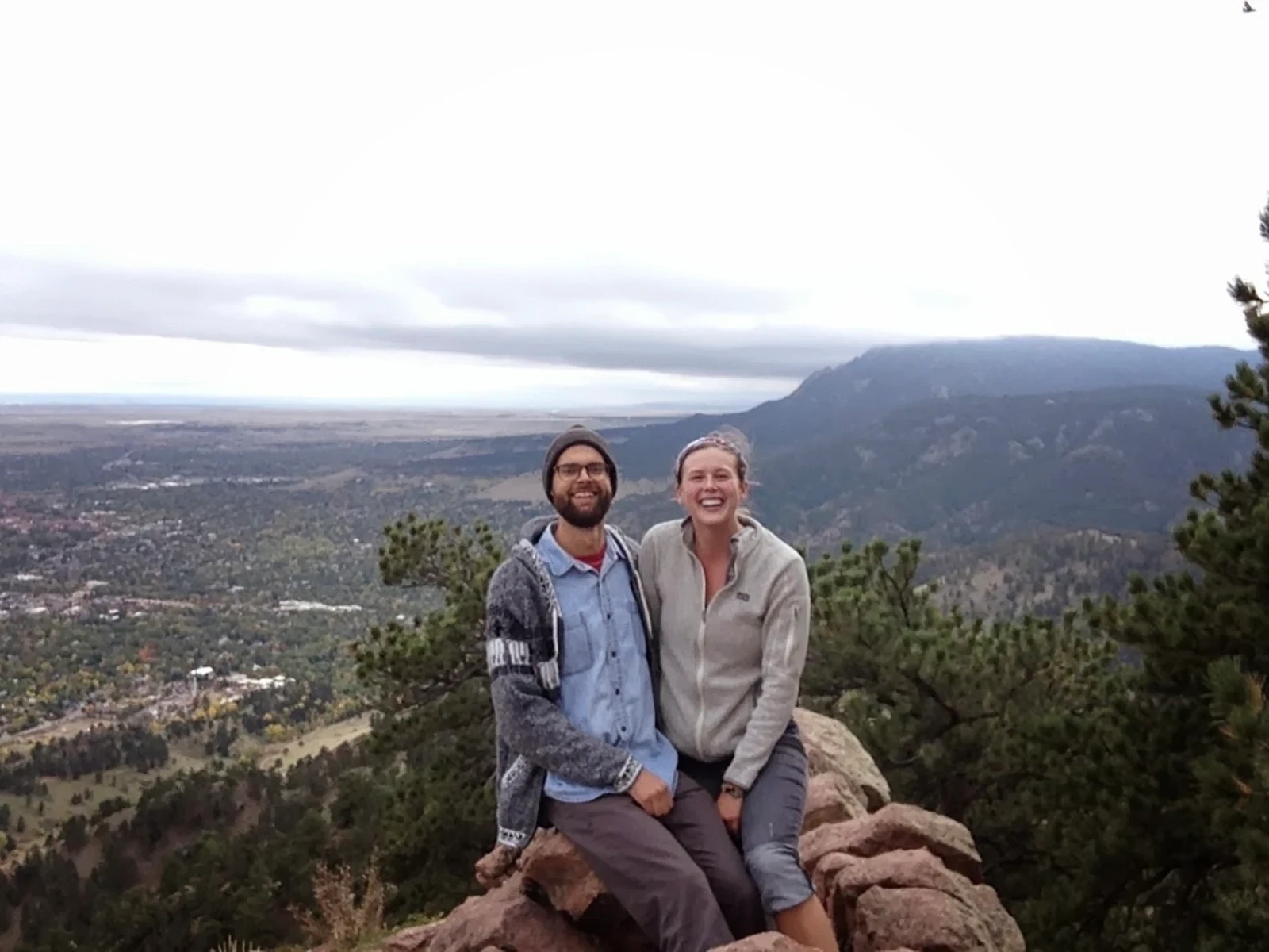 Barry & Nolan sit at a summit along the Canadian Rockies