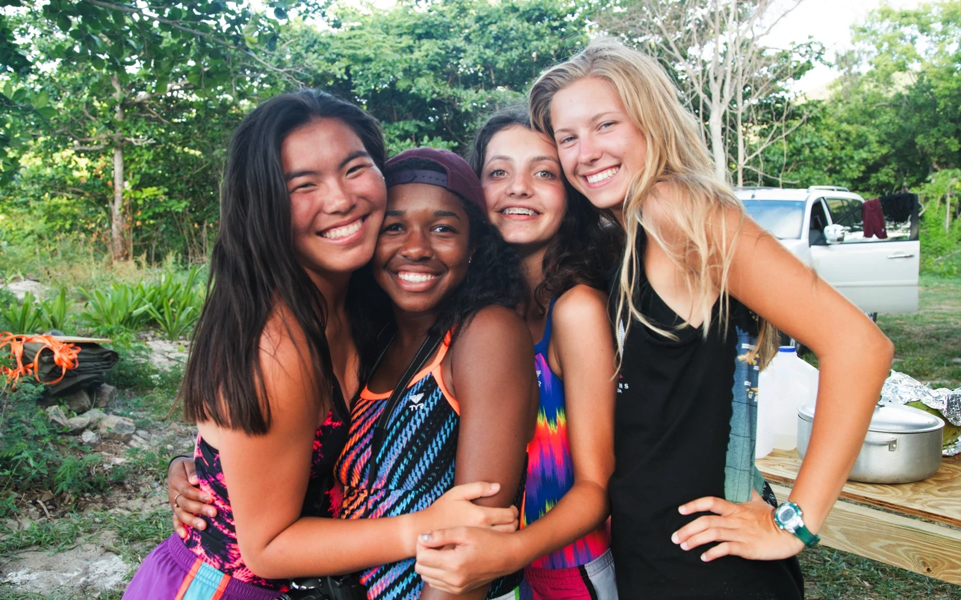 Teen girls pose together in the BVI near their home base