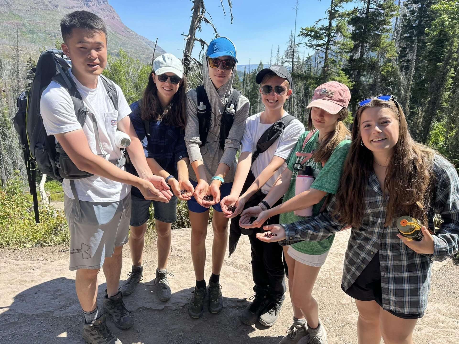 VISIONS teen volunteers show collected juneberries in Montana
